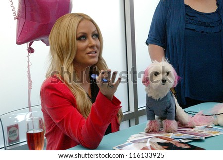 SAN DIEGO, CA - OCTOBER 19: Aubrey O\'Day arrives for a meet and greet on October 19, 2012 at the 10th Grand Opening Celebration of Hollywood Tans salon in San Diego, CA.