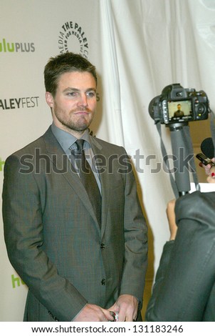 BEVERLY HILLS - MARCH 9: Stephen Amell in interviewed by the media at the 2013 Paleyfest \