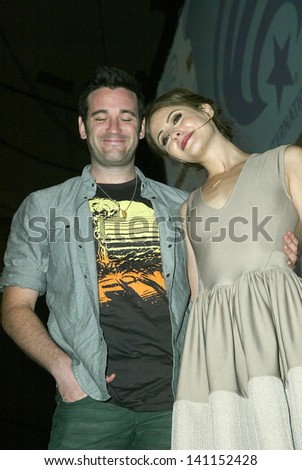 ANAHEIM, CA - MARCH 31: Colin Donnell and Willa Holland pose for photos after a panel discussion at the 2013 Wondercon convention on March 31, 2013 in Anaheim, CA.