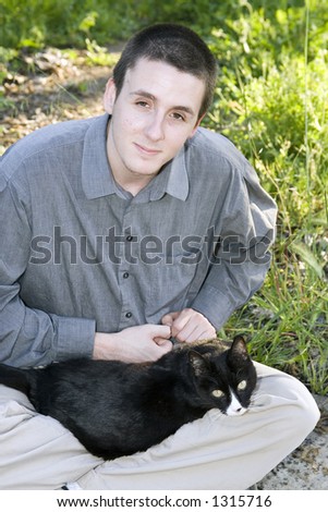 Man with black and white cat