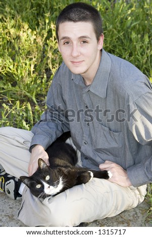 Man with black and white cat