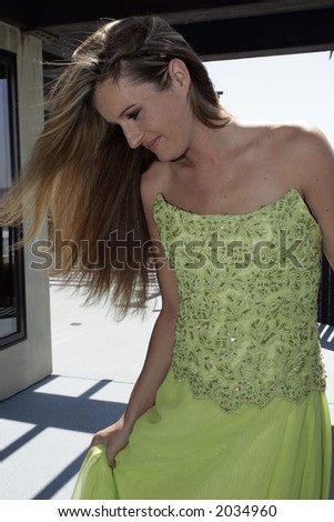 Beauty with green dress and flowing hair