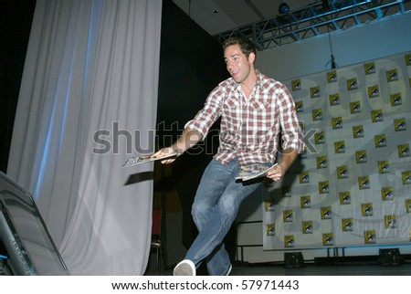 SAN DIEGO, CA - JULY 23: Actor Zachary Levi hands out special edition TV Guides after the TV Guide panel on July 23, 2010 at the 2010 Comic Con International held in San Diego, CA.