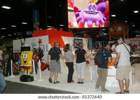 SAN DIEGO, CA - JULY 20: Unidentified fans visit only of the hundreds of pop culture booths during preview night at the 2011 Annual Comic Con International convention on July 20, 2011 in San Diego, CA