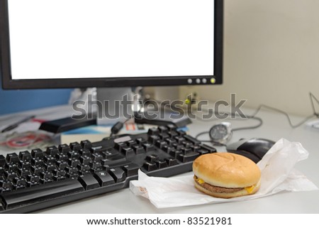 Office business lunch food cheese hamburger, desktop and financial newspaper on office desk