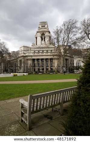 London. View of the Trinity Square Gardens of London and Ten Trinity House in cloudy weather. Spring.
