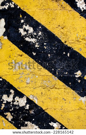 Dirty grunge image of a dirty chevron in black and yellow.