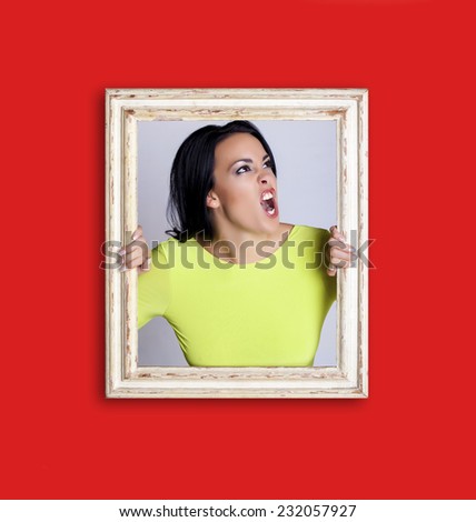 Abstract image of a angry woman trapped in a picture frame.