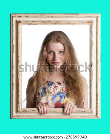 Abstract image of a beautiful woman trapped in a picture frame over a blue background.