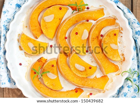 Baked butternut squash with pepper and garlic, top view