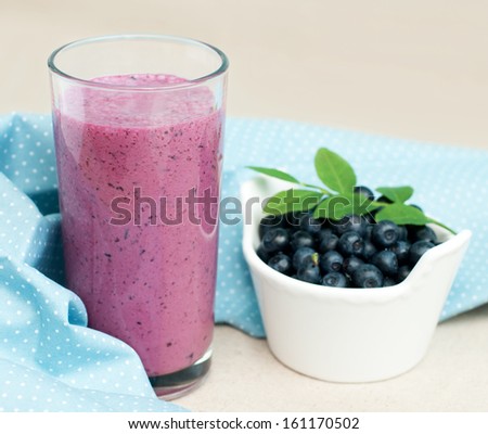 Close up of blueberry smoothie and fresh berries, selective focus