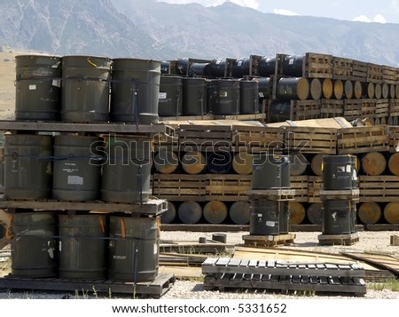 Chemical barrel storage on pallets in a field