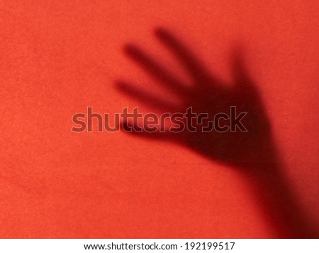 Rescue concept. Hand reaching for help, red.
