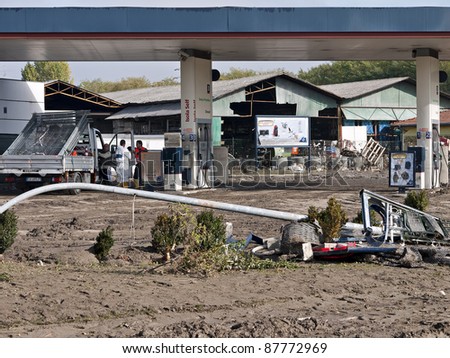 AULLA, ITALY - OCTOBER 28: cleanup after devastating flash floods hit Lunigiana and La Spezia area on Tuesday October 25, 2011. Aulla was badly affected, here is a petrol station, October 28, 2011, Aulla, Italy.