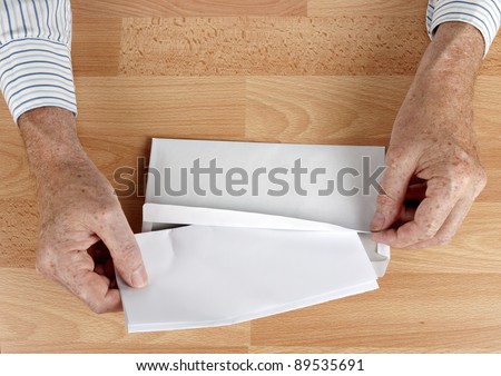 Man mailing letter in white envelope - application, resignation