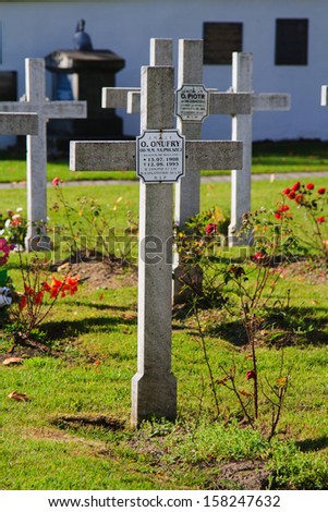 CZERNA, POLAND - OCTOBER 14: Crosses mark the graves of monks near the cloister in Czerna, Poland on October 14, 2013. Cloister itself is more than 300 years old.