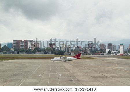 GUATEMALA CITY, GUATEMALA - MAY 08: Guatemala City airport with the city skyline on May 08, 2014 in Guatemala City, Guatemala.