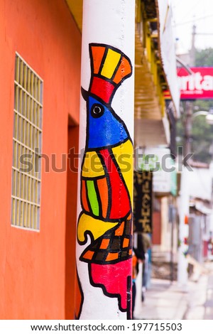 JUAYUA, El SALVADOR - MAY 05:  Mural paintings in La Palma, El Salvador on May 05, 2014. Many houses in El Salvador is decorated in this way.
