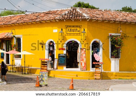 SUCHITOTO, EL SALVADOR - MAY 03: Colorful bright yellow building in Suchitoto, El Salvador on May 03, 2014. Suchitoto is located close to the popular tourist destination - Suchitlan lake.