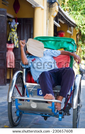 HOI AN, VIETNAM - SEP 5: Man in rickshaw on the street in Hoi An city, Da Nang province, Vietnam on Sep 5, 2011. Hoi An is recognized as a World Heritage Site by UNESCO.