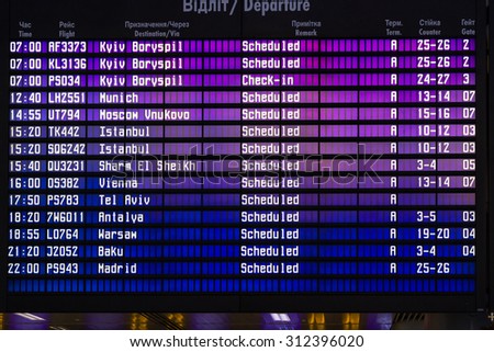 LVIV, UKRAINE  - JULY 5: Airport departures board on July 05, 2015 at Lviv Halytskyi airport, Ukraine.  The airport was built specially for the Euro 2012.