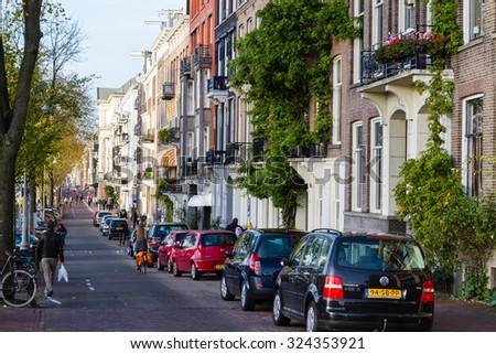 AMSTERDAM, THE NETHERLANDS - NOVEMBER 10: Amsterdam street with 17th century residence buildings in the city center, Netherlands on November 10, 2014.