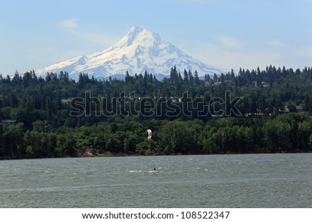 Wind surfing in the Columbia Gorge in Washington, with Mount Hood