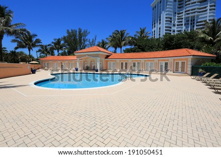 Upscale swimming pool and cabanas on Singer Island, in South Florida, USA