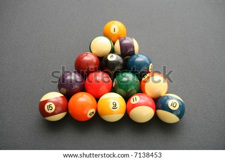 Colorful Billiard Balls on a Pool Table with gray felt