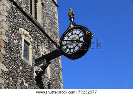 Beautiful modern clock on an ancient stone tower in Canterbury, England