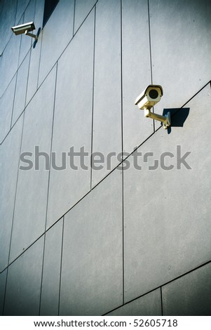 Security camera on dark modern building
