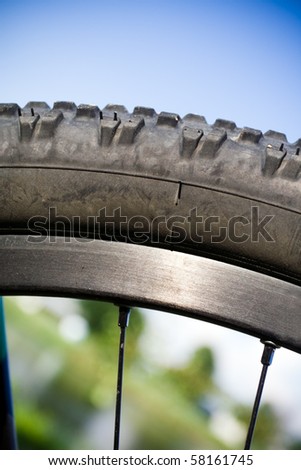 Mountain bike wheel closeup outdoors with blurred background