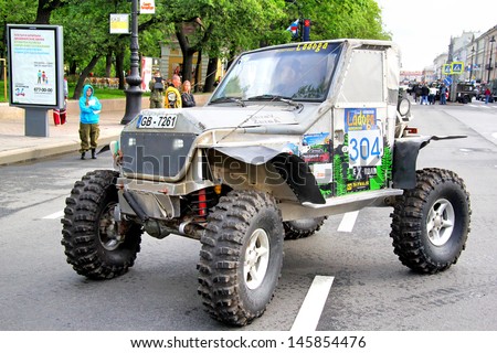 SAINT PETERSBURG, RUSSIA - MAY 25: Vilnis Zeiza\'s off-road vehicle Toyota Land Cruiser 80 No.304 competes at the annual Ladoga Trophy Challenge on May 25, 2013 in Saint Petersburg, Russia.