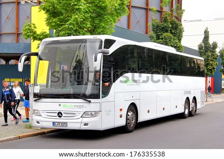 BERLIN, GERMANY - SEPTEMBER 12, 2013: White Mercedes-Benz O350-16RHD Tourismo coach at the city street.