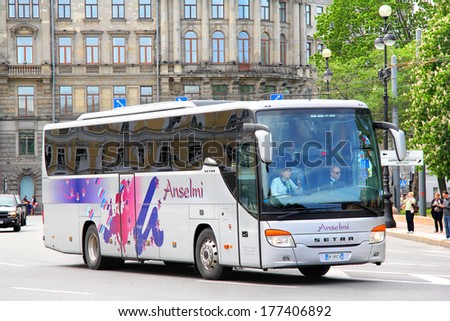 SAINT PETERSBURG, RUSSIA - MAY 25, 2013: Grey Setra S415GT-HD interurban coach at the city street.