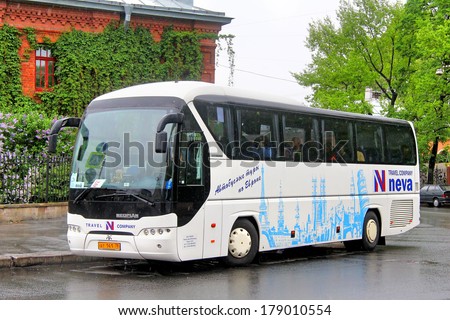 SAINT PETERSBURG, RUSSIA - MAY 25, 2013: White Neoplan N2216SHD Tourliner interurban coach at the city street.