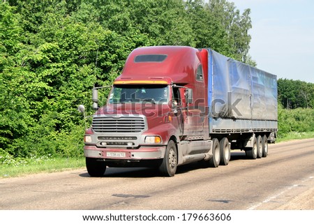 TATARSTAN, RUSSIA - JUNE 14, 2008: Red Sterling AT9500 Silver Star semi-trailer truck at the interurban road.