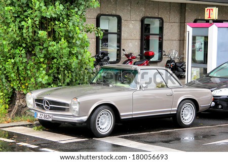 BERLIN, GERMANY - SEPTEMBER 10, 2013: Grey Mercedes-Benz W113 280SL vintage motor car at the city steet.