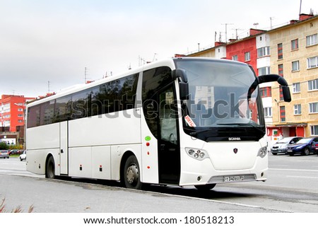 NOVYY URENGOY, RUSSIA - SEPTEMBER 1, 2012: White Scania OmniExpress 340 interurban coach at the city street.