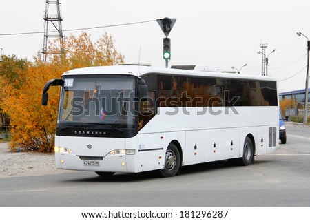 NOVYY URENGOY, RUSSIA - SEPTEMBER 13, 2012: White Volzhanin 5285 interurban coach at the city street.