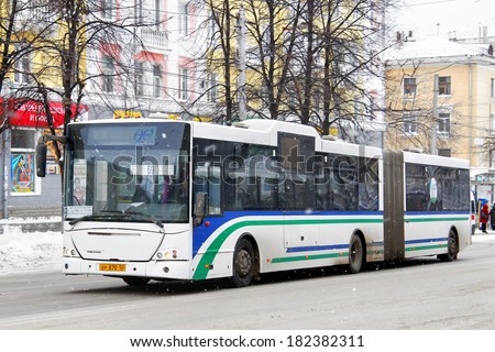 UFA, RUSSIA - NOVEMBER 21, 2011: White NEFAZ 52995 articulated city bus at the city street.