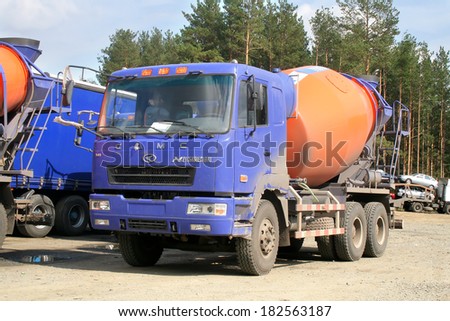 CHELYABINSK REGION, RUSSIA - AUGUST 23, 2008: New CAMC concrete mixer truck at the interurban road.