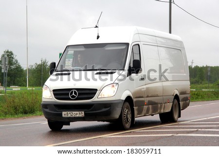 TVER REGION, RUSSIA - MAY 22, 2013: White Mercedes-Benz Sprinter cargo van at the interurban road.