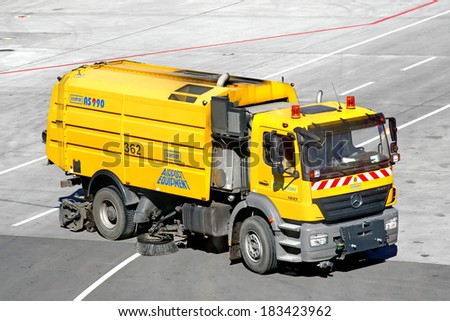 MOSCOW, RUSSIA - JUNE 4, 2012: Yellow Mercedes-Benz Axor 1823 washing and cleaning machine at the Vnukovo international airport.