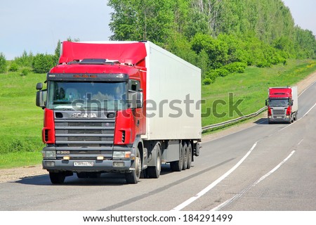 VLADIMIR REGION, RUSSIA - MAY 29, 2013: Scania R380 semi-trailer trucks at the interurban road.