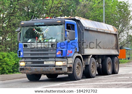 MOSCOW REGION, RUSSIA - MAY 22, 2013: Blue Scania P380 dump truck at the interurban road.