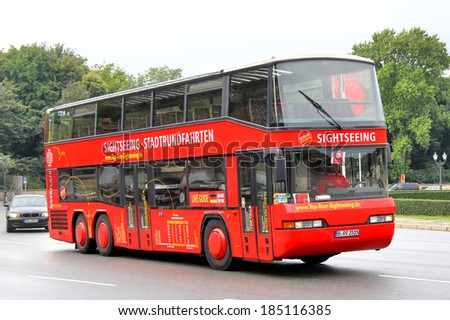 BERLIN, GERMANY - SEPTEMBER 10, 2013: Red Neoplan N4026/3 sightseeing bus at the city street.