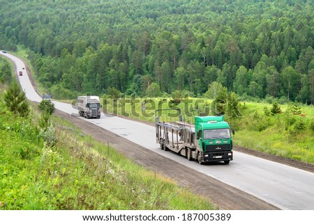 BASHKORTOSTAN, RUSSIA - JUNE 29, 2008: Green MAZ 5440 semi-trailer truck at the interurban road.