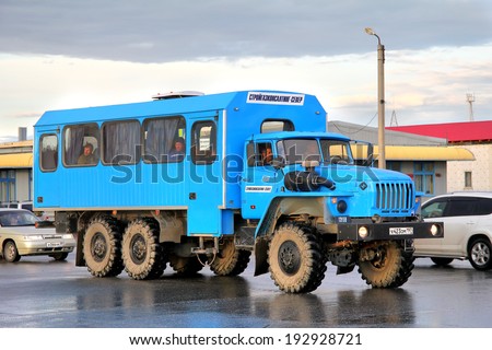 NOVYY URENGOY, RUSSIA - SEPTEMBER 6, 2012: Blue Ural 3255 off-road bus at the city street.