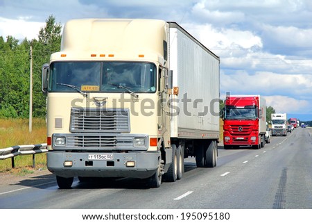BASHKORTOSTAN, RUSSIA - JULY 28, 2012: Beige International 9800 semi-trailer truck at the interurban road.